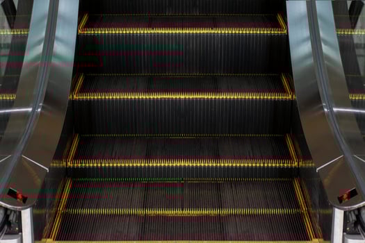 Escalators in an office building. Empty escalator stairs photo