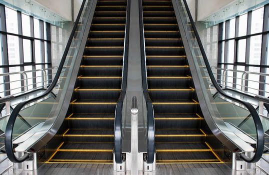 Escalators in an office building. Empty escalator stairs photo