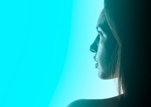 artistic view of depressed female model posing in studio photo