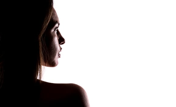 artistic view of depressed female model posing in studio photo