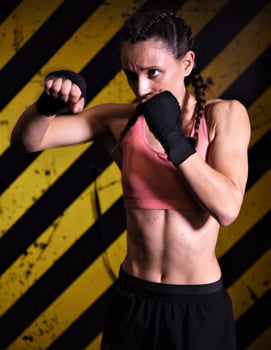 MMA woman fighter tough chick boxer punch pose pretty exercise training cross fit athlete photo