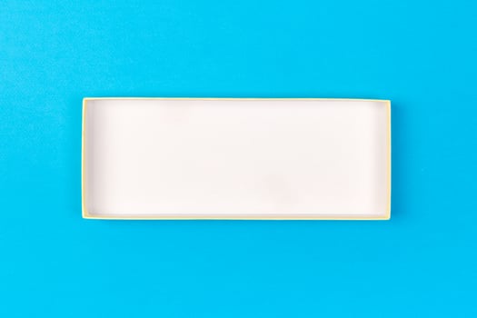 Empty box for product on blue background. top view photo