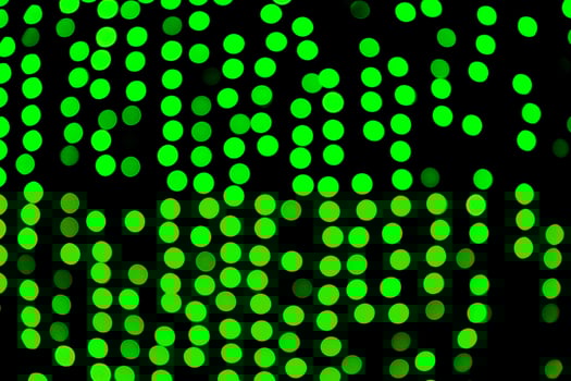 Unfocused abstract green bokeh on black background. defocused and blurred many round light photo