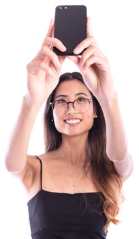 Asian woman making selfie with her cell phone photo