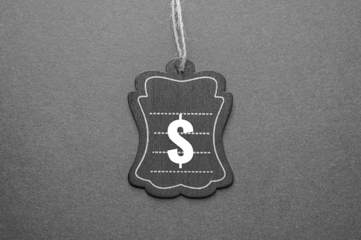 black price tag with dollar sign on the black background, black mockup photo