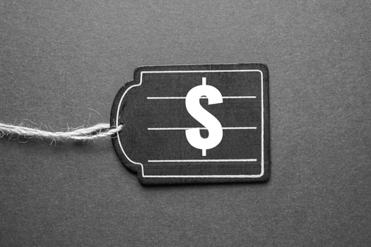 black price tag with dollar sign on the black background, black mockup photo