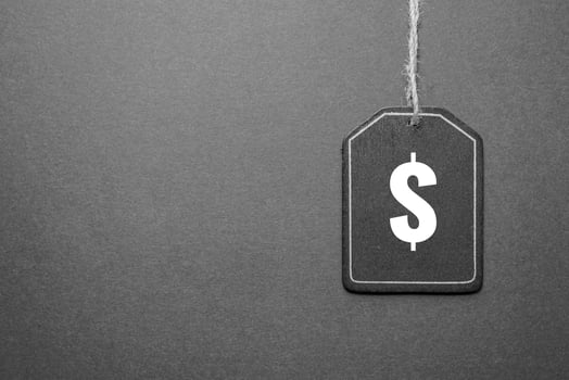 black price tag with dollar sign on the black background, black mockup photo