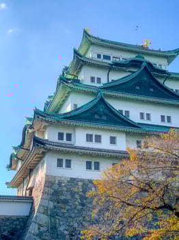 Nagoya castle with a clear sky during autumn leaves seasoning. Nagoya castle is a top landmark in Chubu central of Japan and has samurai as the castle symbol. photo