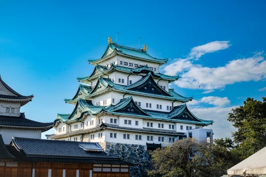 Nagoya castle with a clear sky during autumn leaves seasoning. Nagoya castle is a top landmark in Chubu central of Japan and has samurai as the castle symbol. photo