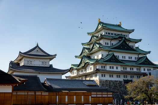 Nagoya castle with a clear sky during autumn leaves seasoning. Nagoya castle is a top landmark in Chubu central of Japan and has samurai as the castle symbol. photo