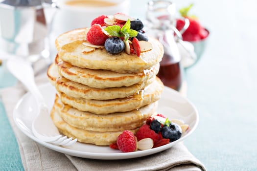 Fluffy oatmeal pancakes stack with fresh berries photo