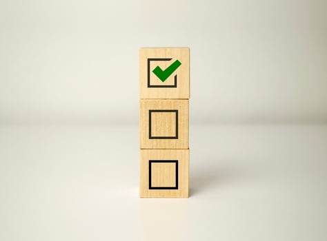Checklist concept, wooden blocks cubes with icon photo