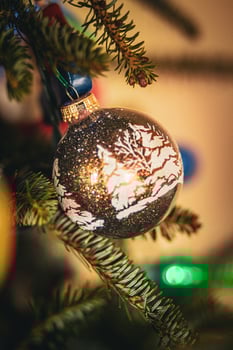 Christmas Scene Ornament Hanging on a Christmas Tree photo
