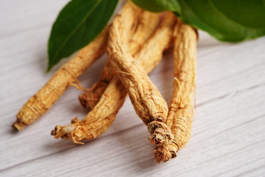 Ginseng roots and green leaf, healthy food. photo