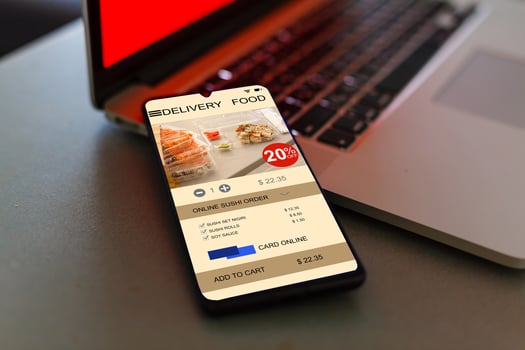phone with app delivery food screen photo