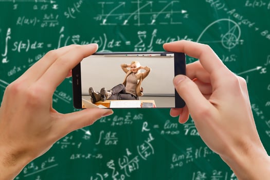 Man use mobile phone,blur image of classrooms are empty as background. photo
