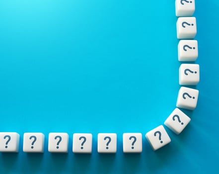 Blocks with question marks and copy space. Questions and problem solving. Frequently asked Questions FAQ. Interesting information and unknown facts. Explanations. Health and reproduction. photo