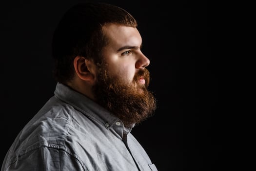 Serious fashionable man with beard mustache in suit. Mens beauty, fashion. Fashion portrait of hipster man.with beard touching his mustache. photo