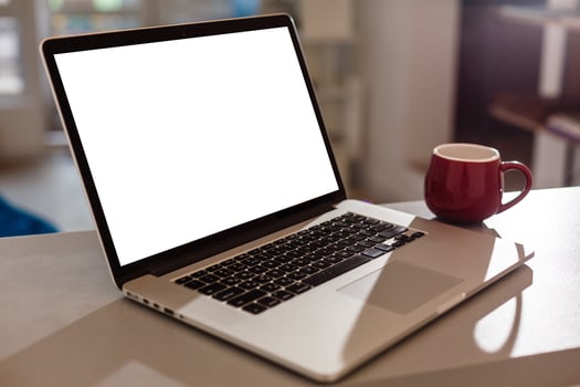 Laptop with blank screen . Home interior or office background photo
