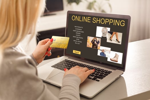 Young Woman On Sofa Shopping Online With Debit Card photo