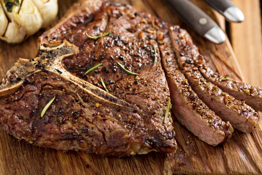 Beef steak cooked on a grill photo
