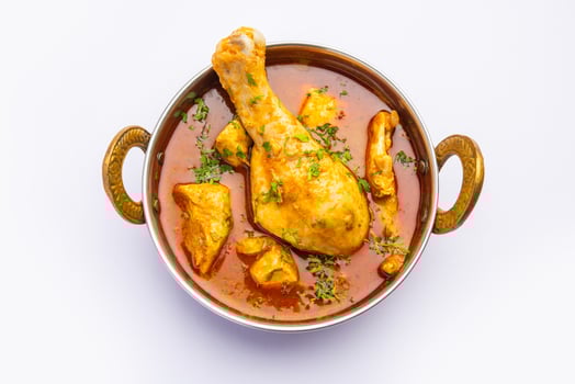 Red Chicken Curry or murgh Masala or korma with prominent Leg Piece photo