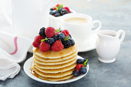 Stack of buttermilk pancakes with fresh berries photo