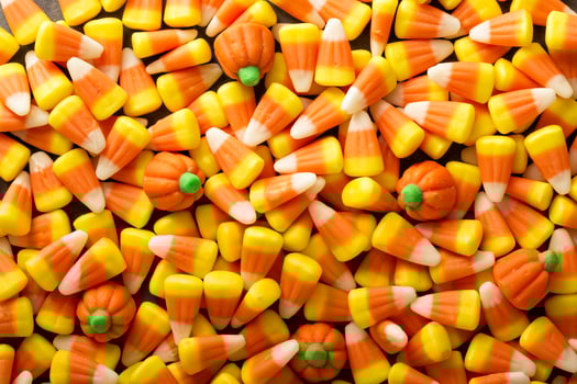 Candy corn and pumpkin Halloween background photo