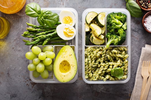 Vegetarian meal prep containers with pasta and vegetables photo