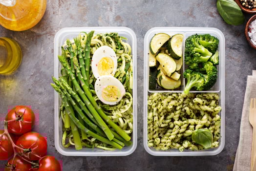 Vegetarian meal prep containers with pasta and vegetables photo
