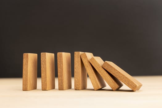 Falling wooden Dominoes effect photo