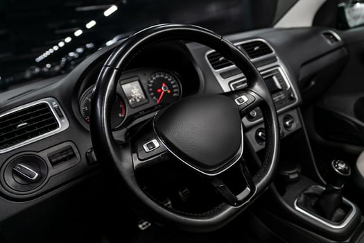 dashboard, speedometer, tachometer  with white backlight  steering wheel  with car controller system function. photo