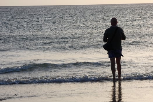 Beach shore fishing, traditional fishing as a hobby photo