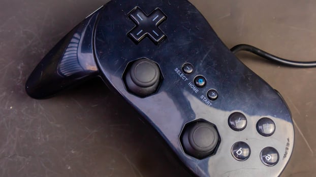 black joystick isolated black background photo