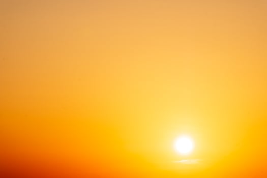beautiful gradient orange clouds and sunlight on the blue sky perfect for the background, take in everning,Twilight photo