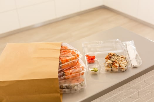 Take-Out Makizushi Meal, California, Shrimp Tempura, and Tuna Rolls, with Soy Sauce, Pickled Ginger, and Miso soup. photo
