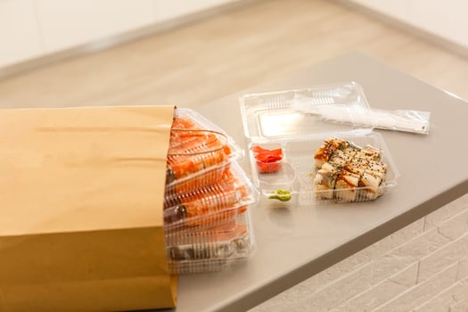 Sushi roll set on wooden table. Japan food delivery. photo