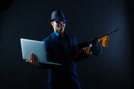 Film noir gangster shooting with gun photo