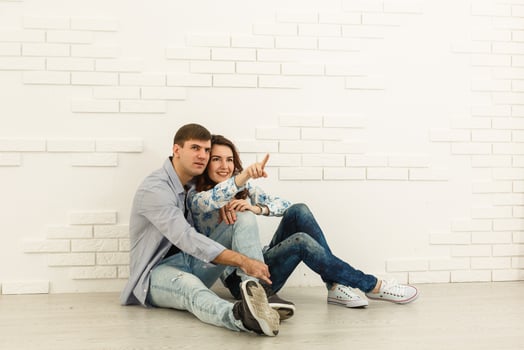 Happy young couple moving in their new apartment photo