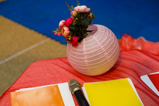 Flower vase and microphone at a wedding photo
