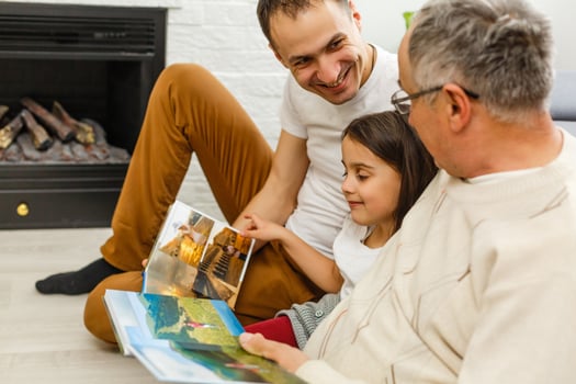 Happy multi generation family, father and adult son, granddaughter photo