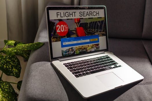 flight search on internet website, travel planning concept, airplane tickets online. photo