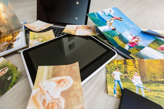 Hipster photography equipment with laptop and digital tablet on a vintage wooden desktop, flat lay photo