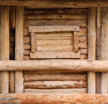 Log cabin barn unpainted debarked wall textured horizontal background photo
