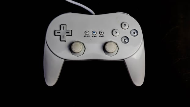 white joystick isolated black background photo