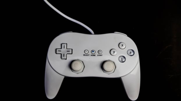 white joystick isolated black background photo