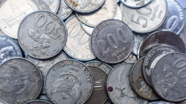 pile of rupiah coins as background photo