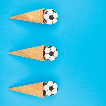 Football macaroons in waffle cones photo