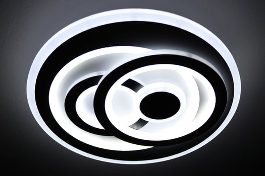 Interior lamp that emits white light,and it has the form of a double circle photo