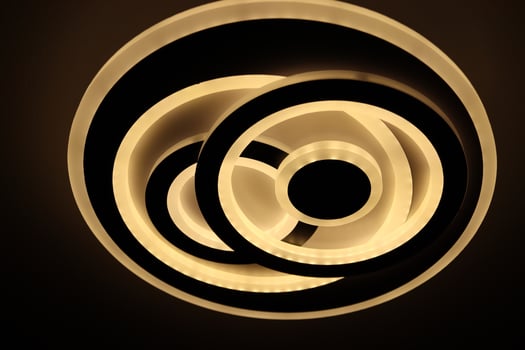 Interior lamp that emits white light,and it has the form of a double circle photo
